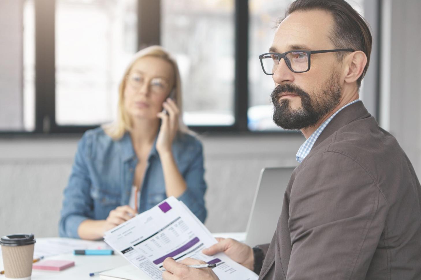 Modern business finance learning facility with comfortable seating and natural lighting
