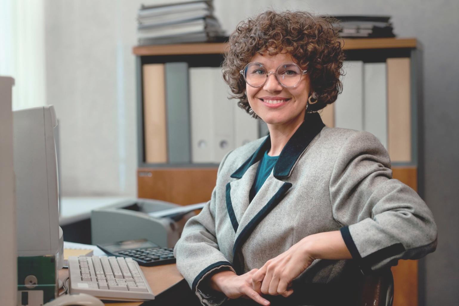 Close-up view of financial documents and calculator showing budget analysis