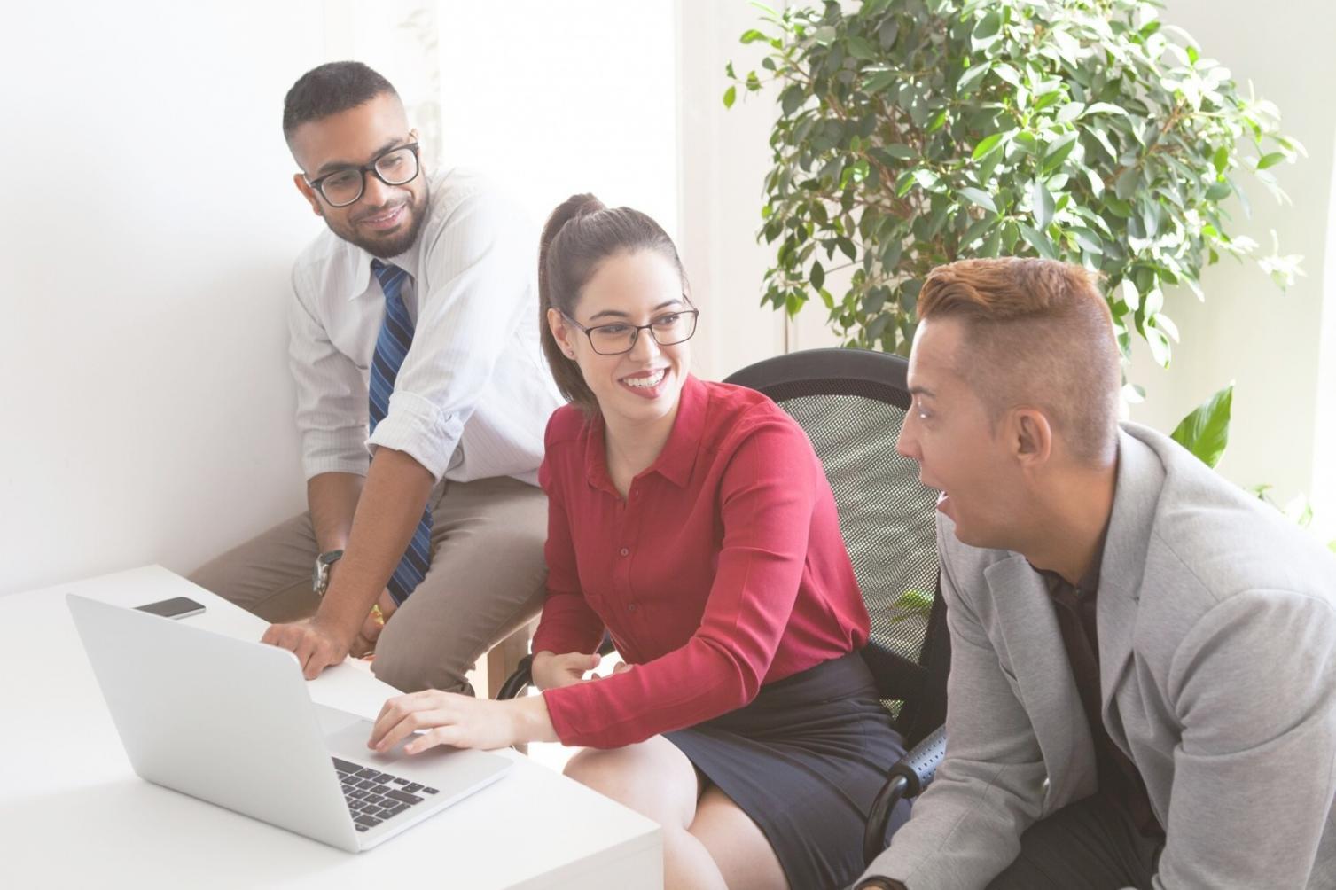 Business owner reviewing financial projections and growth plans on laptop